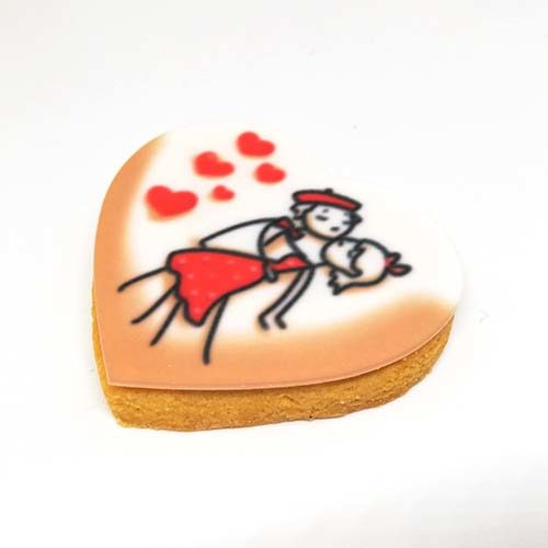 Coppia di innamorati stampata su biscotto a forma di cuore